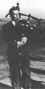 Douglas playing the bagpipes